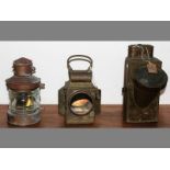 THREE BRASS STORM LANTERNS OF VARIOUS SHAPES AND SIZES