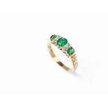 Lady’s Ring with 3 Emeralds of c. 0.80 ct. and 4 Diamonds, 18K 18 karat yellow goldEurope, early