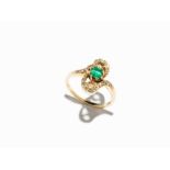 A Ladies’ Ring with Central Emerald and 20 Diamonds, 18K Yellow Gold 18 karat yellow goldEurope, 2nd