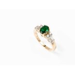 Lady’s Ring with 1 Emerald of 0.9 ct. and 8 Diamonds, 18K Gold 18 karat yellow gold (tested)