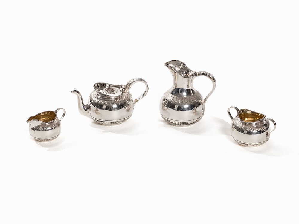 A 4 Piece Silver Service, Goldsmiths & Silversmiths London 1903 Sterling silver, embossed, chiseled,