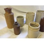 Stoneware ink bottles and other stonewre pots and a clay pipe.