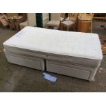 An as new single divan bed with Sealy matress.