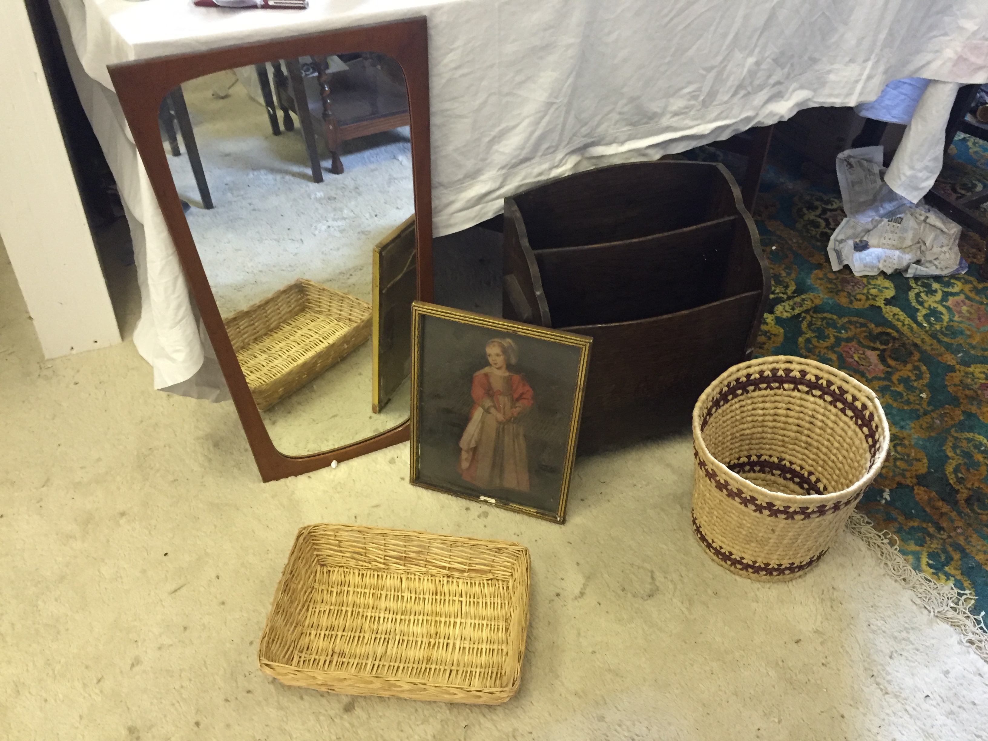 A teak mirror baskets and a magazine rack.