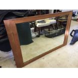 A Victorian pine framed over mantle mirror.