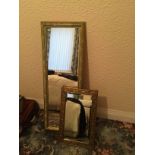 Two decorative mirrors.