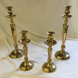 Two pairs of brass candlesticks.