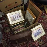A box of picture frames and a leather satchel.