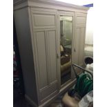 A large painted sectional Victorian double wardrobe.