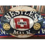 Metallic and enamel ‘Nestle’ advertising sign circa 1950