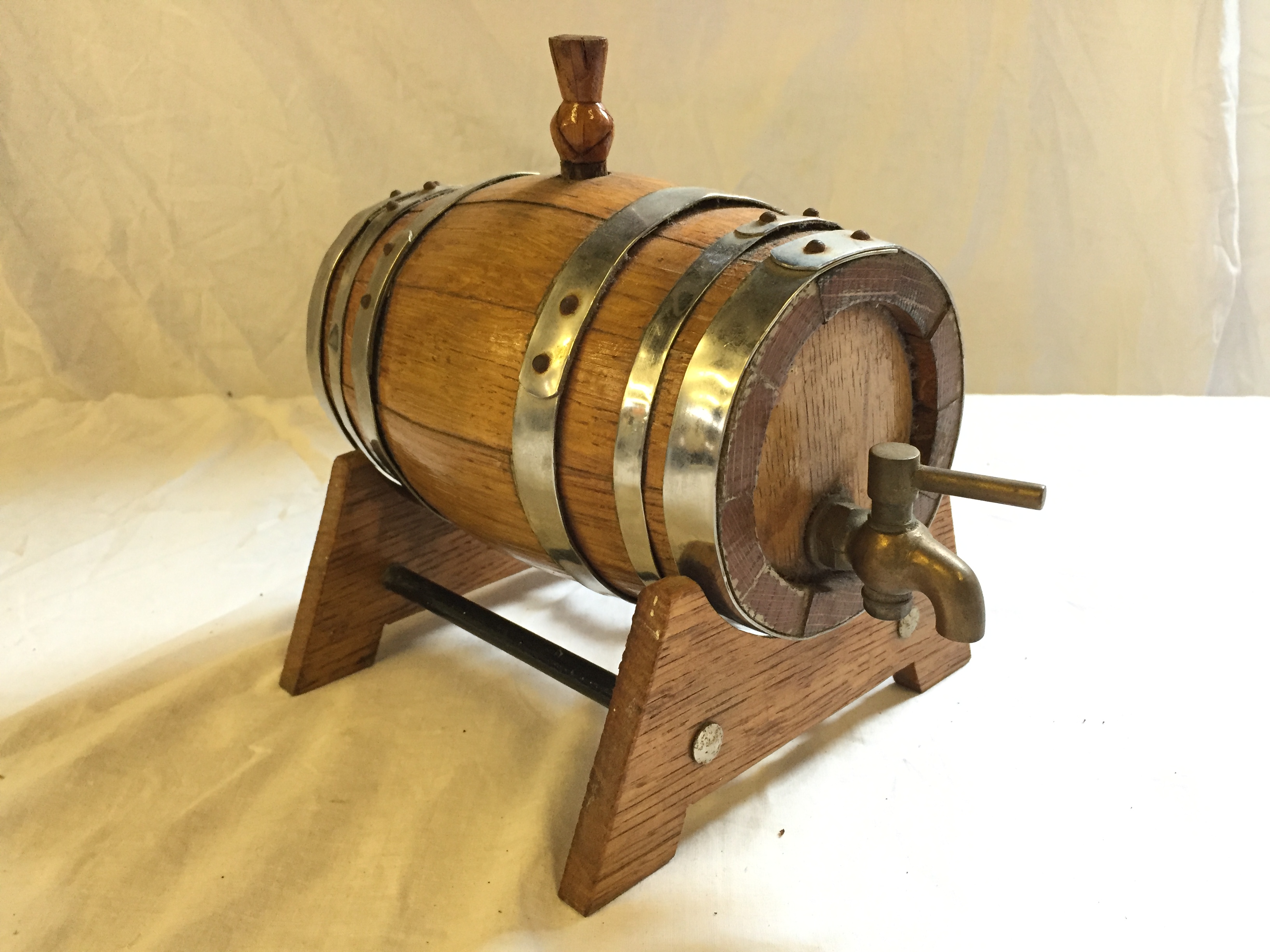 A wooden miniature Whisky barrel.