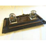 A desk pen tray with two inkwells.