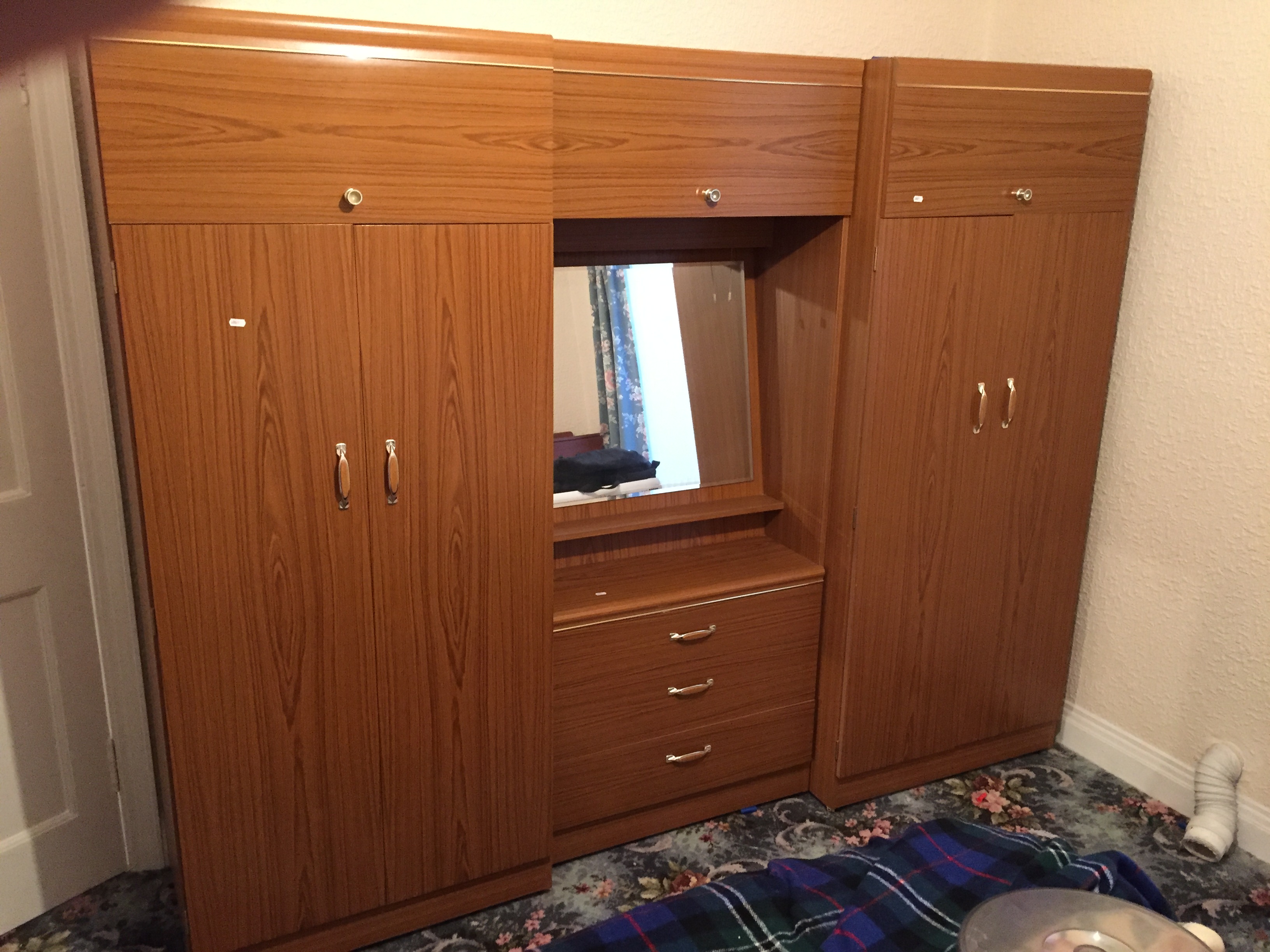 Two double wardrobes and a dressing table.