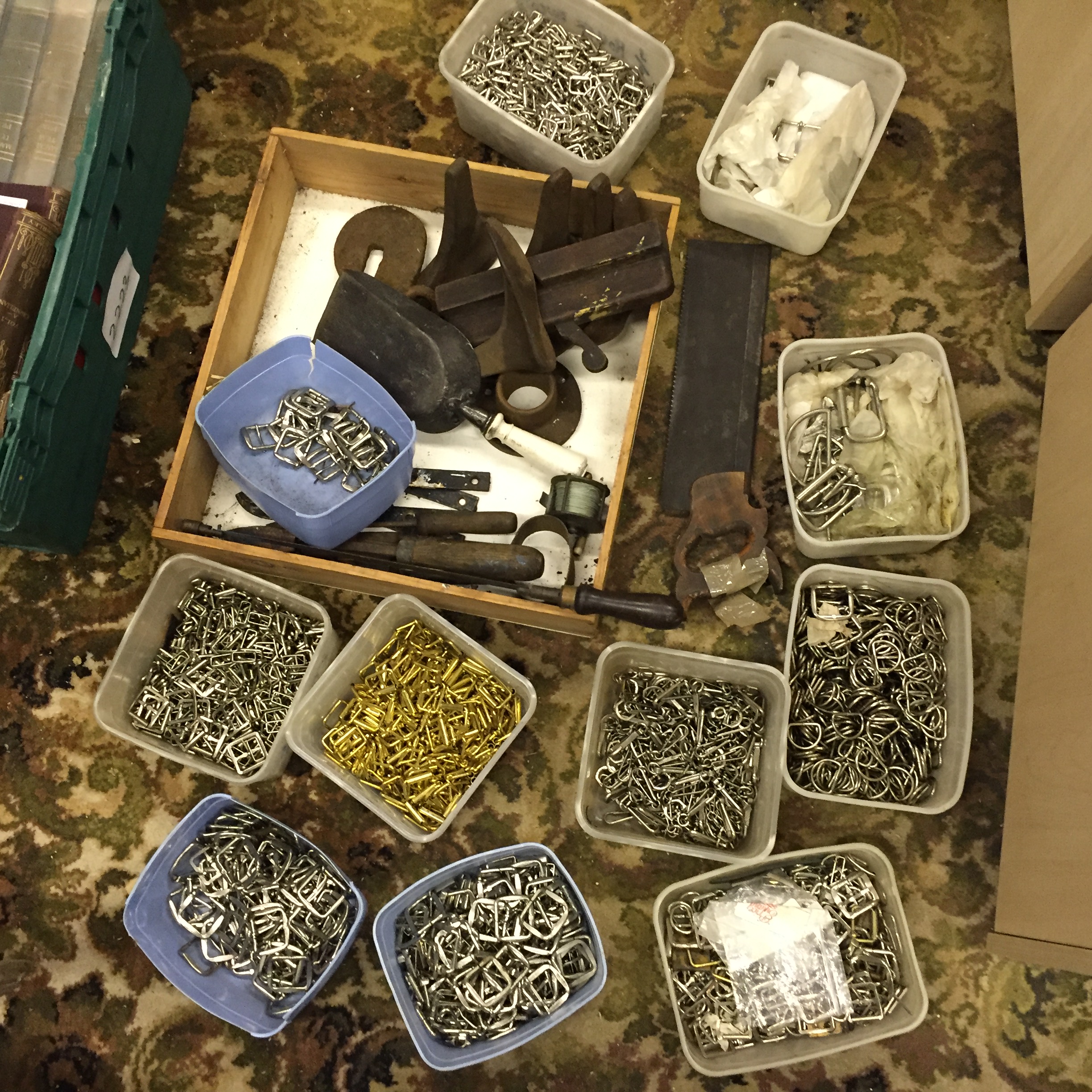 A large selection of belt buckles and clasps for making belts tools and cobblers shoe lasts.