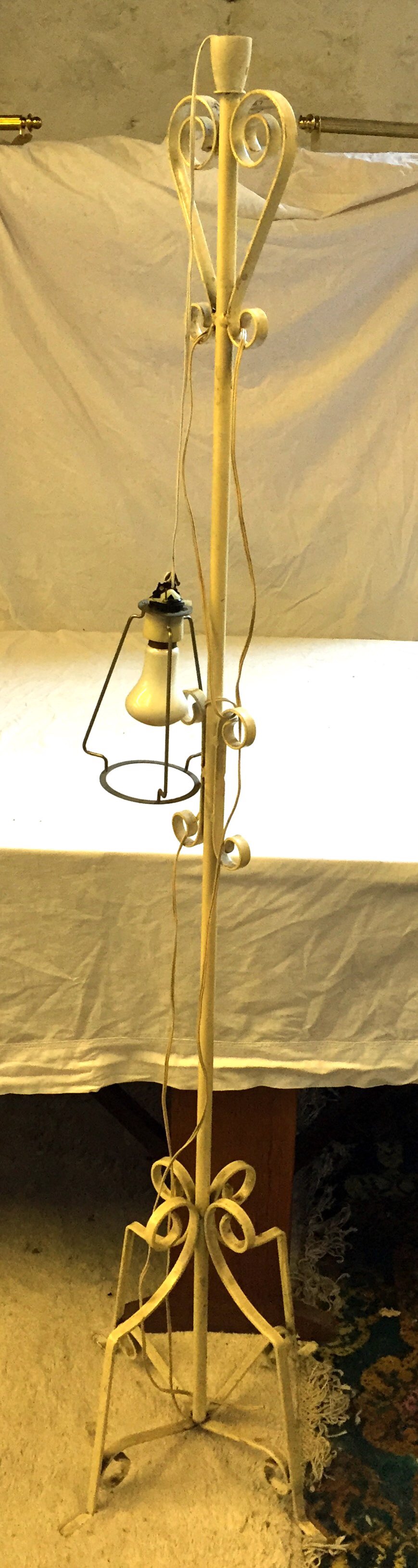 A wrought iron standard lamp.