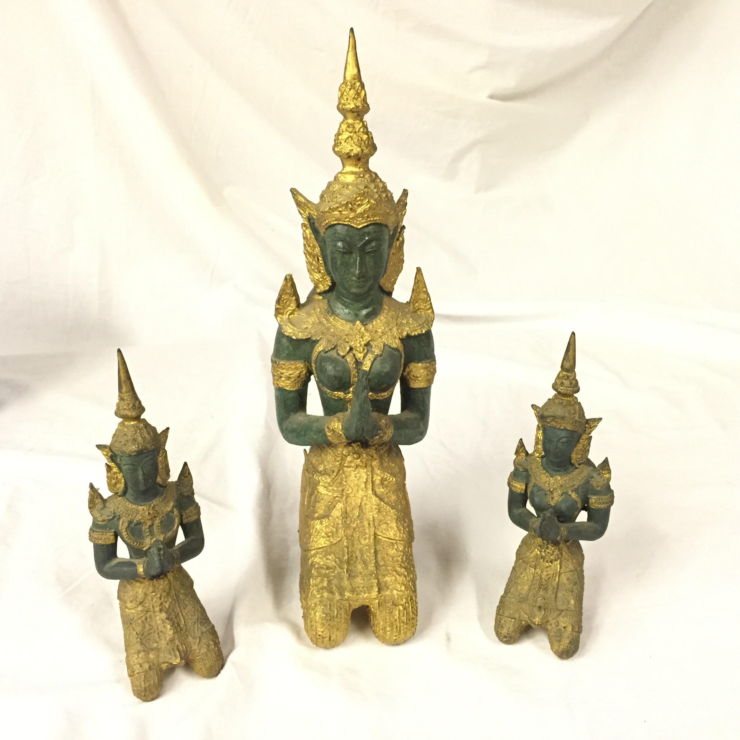 Three cast Thai gods.