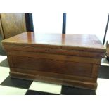A Victorian pine kist with candle drawer.
