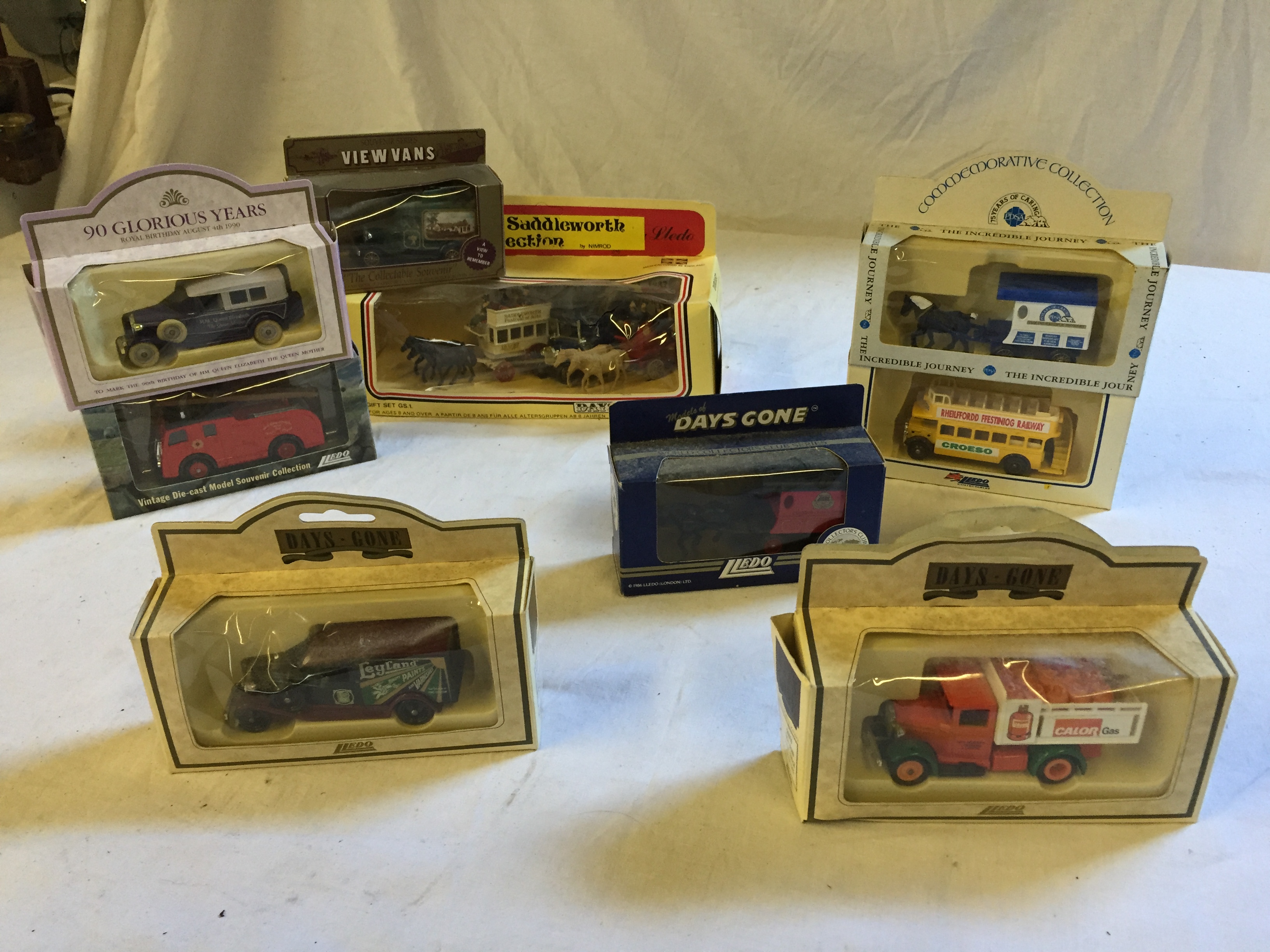 Nine boxed collectable Lledo collectable toy car models.