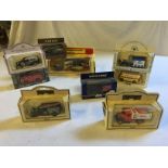 Nine boxed collectable Lledo collectable toy car models.