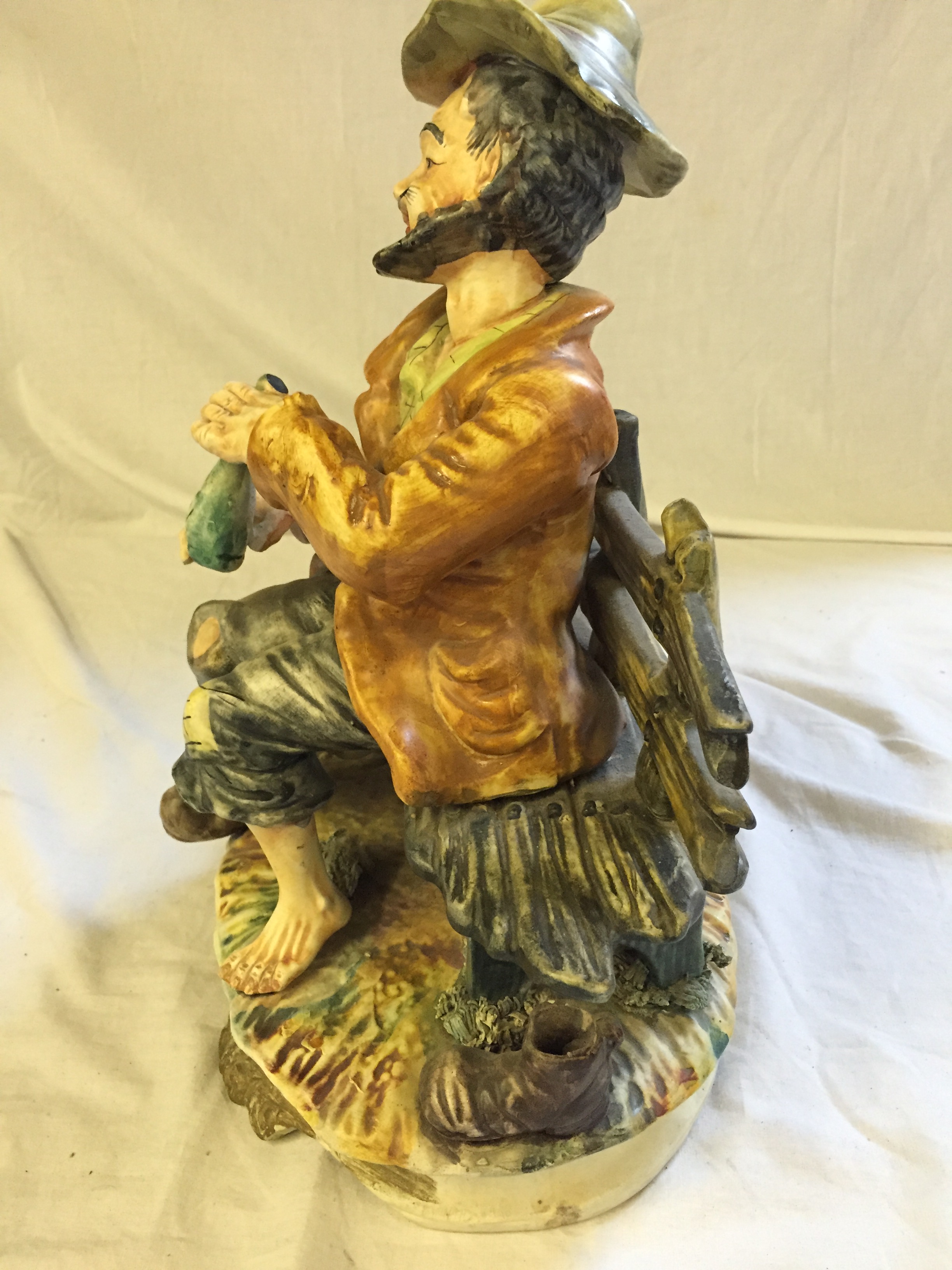 A Capodimonte figure of tramp with dog drinking gin. - Image 2 of 4