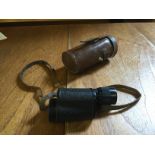 A Russian monocular with leather case.