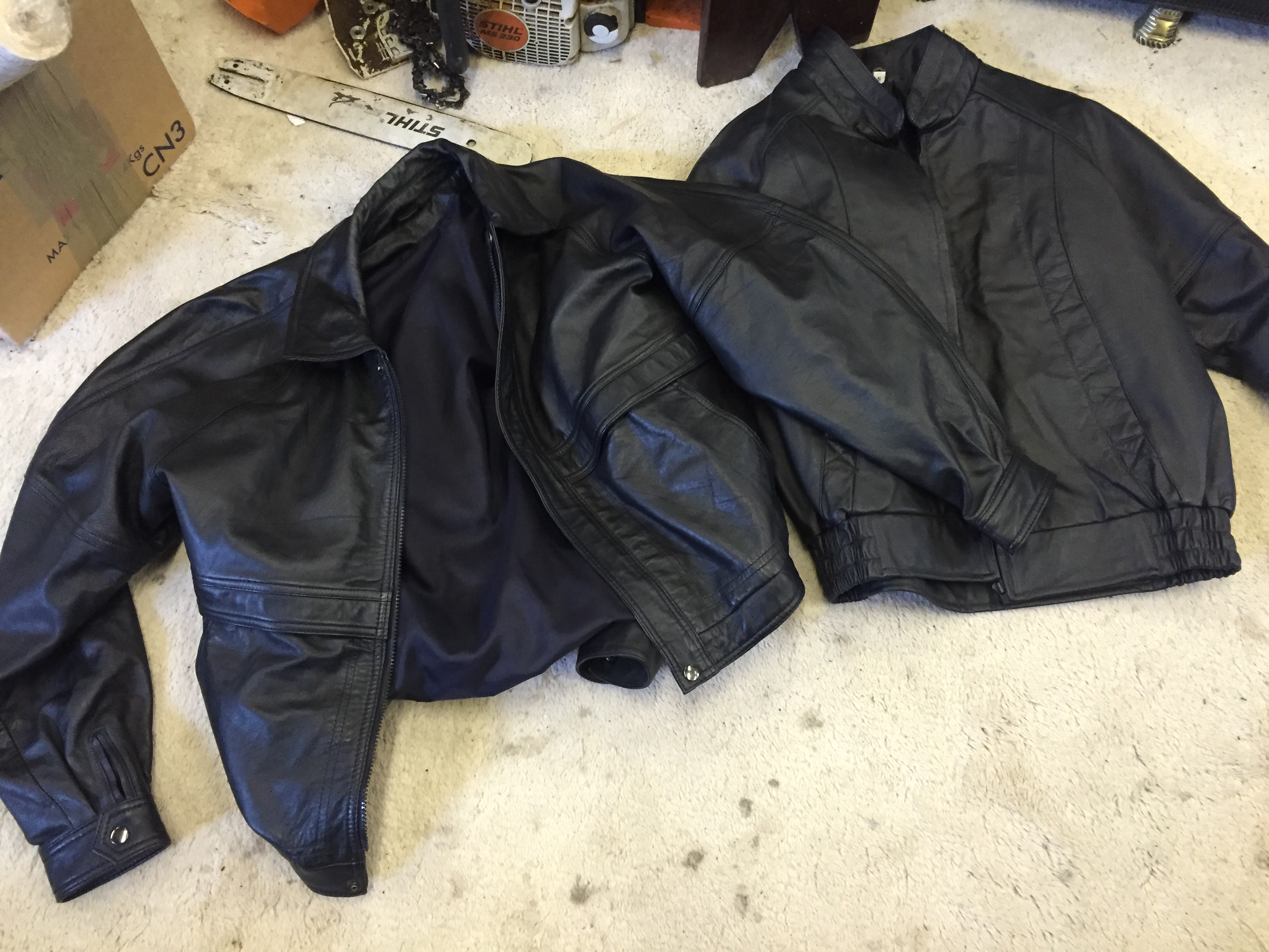 Two black leather jackets one 48 one small both bomber style