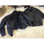 Two black leather jackets one 48 one small both bomber style