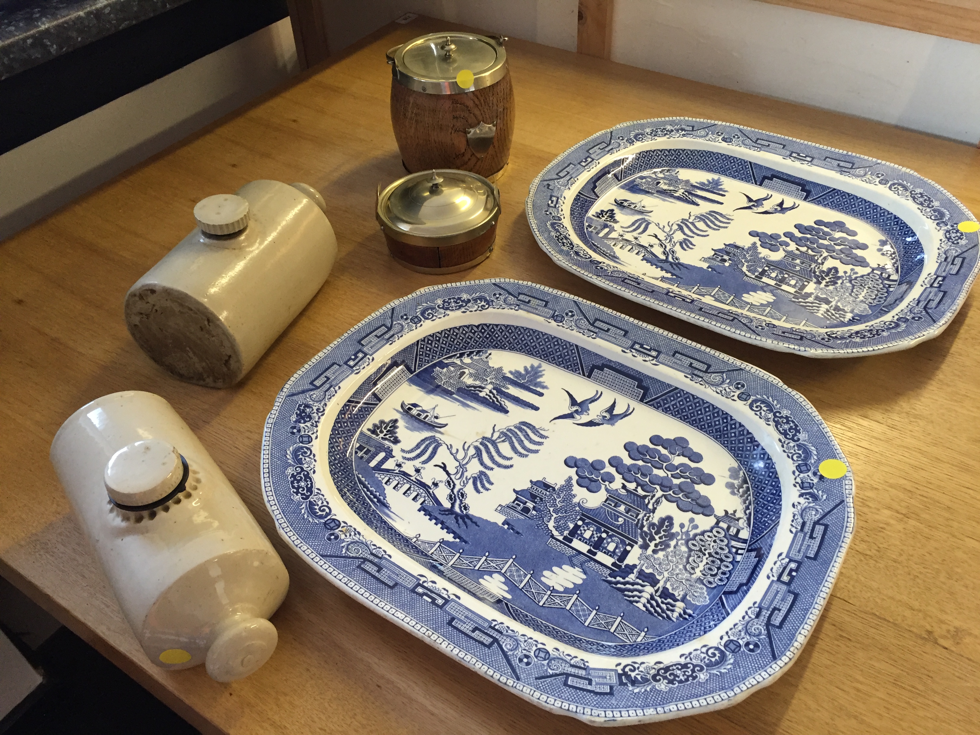 Two large Willow pattern ashets, two hot water pigs and two trine barrels.