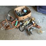 A mixed box of various items including tools.