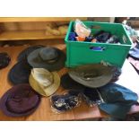 A box containing hats and skull cap covers.