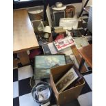 A large general lot including various household items pictures and others.