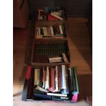 Four boxes of books including a set of Dickens novels.
