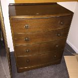 A four drawer chest of drawers.