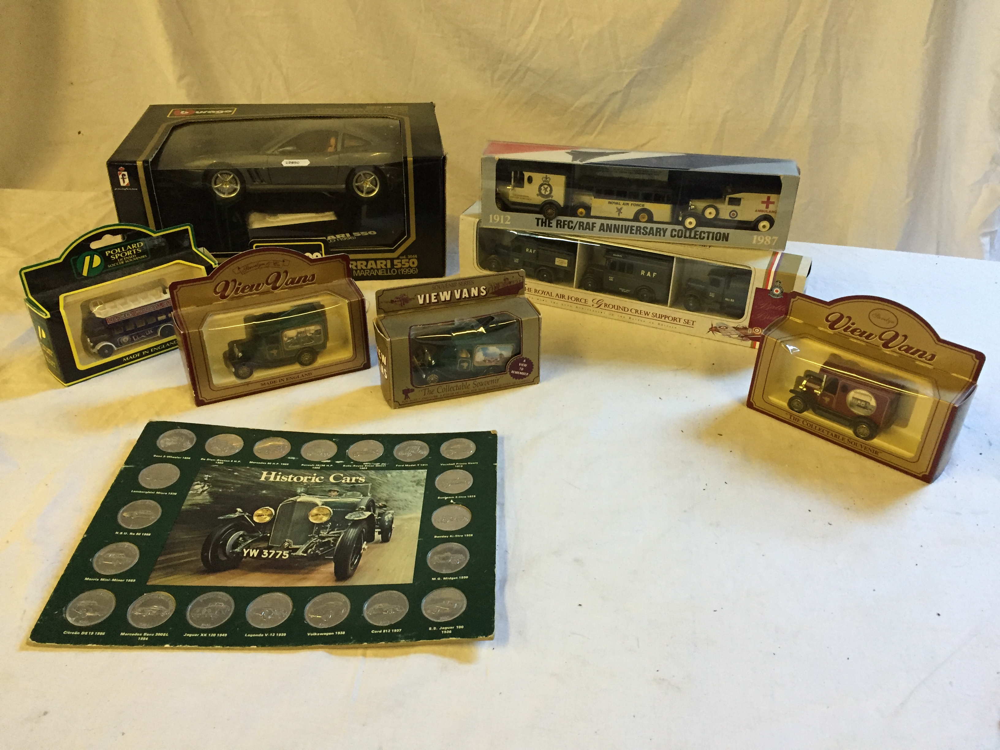 Seven boxed collectable toy cars including A Ferrari 550 Maranello (1996) and a Historic Cars coin