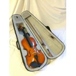 A cased violin with bow.