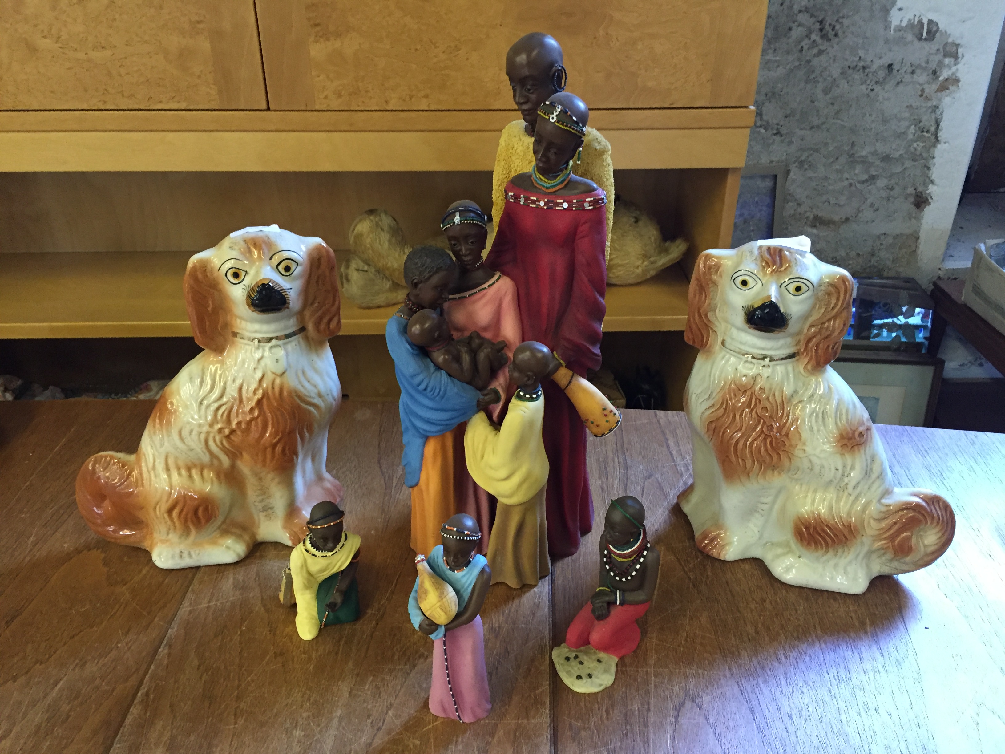 Modern African figures and two wally dogs.
