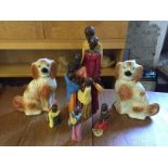 Modern African figures and two wally dogs.
