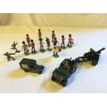 Eleven W Britain Scots guard toy soldiers a Britain Jeep with artillery gun.