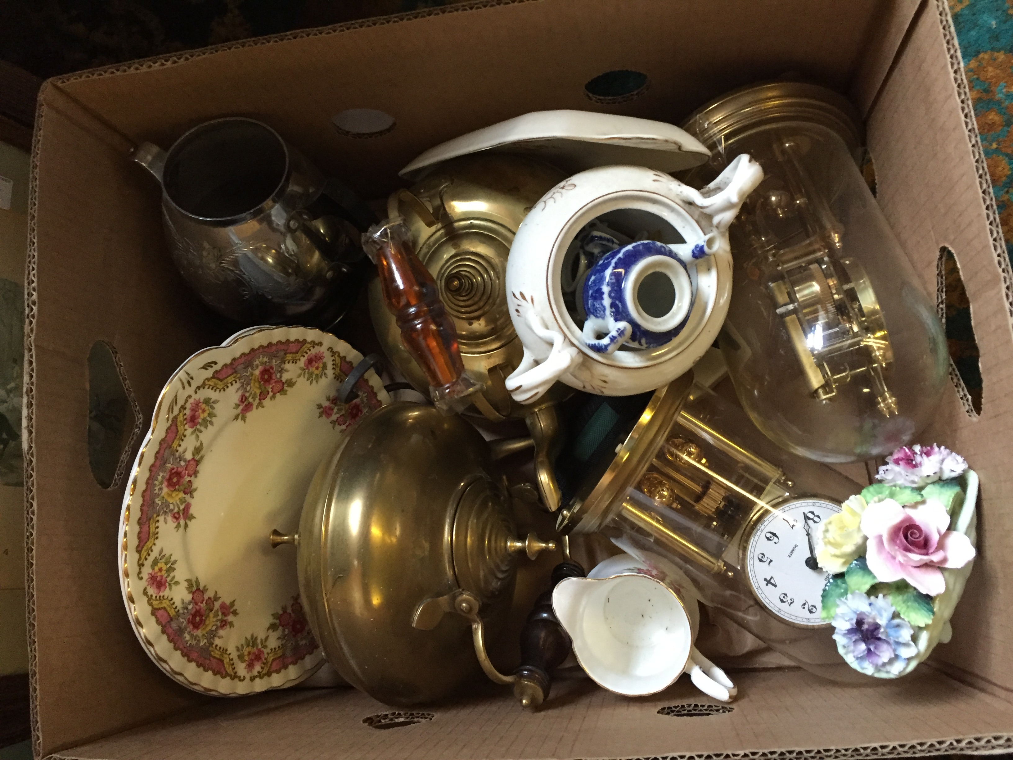 A box containing various ceramics.