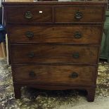 An early Georgian chest of two drawers over three with beaded moulding and oval brass handles with