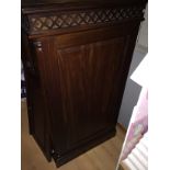 A dark wood television cabinet with drawer beneath. Needs slight repair to door.