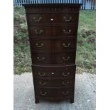 A mahogany bow fronted chest on chest having moulded cornice to top and four graduated drawers to