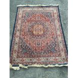 A wool rug 185 mm x 160 mm