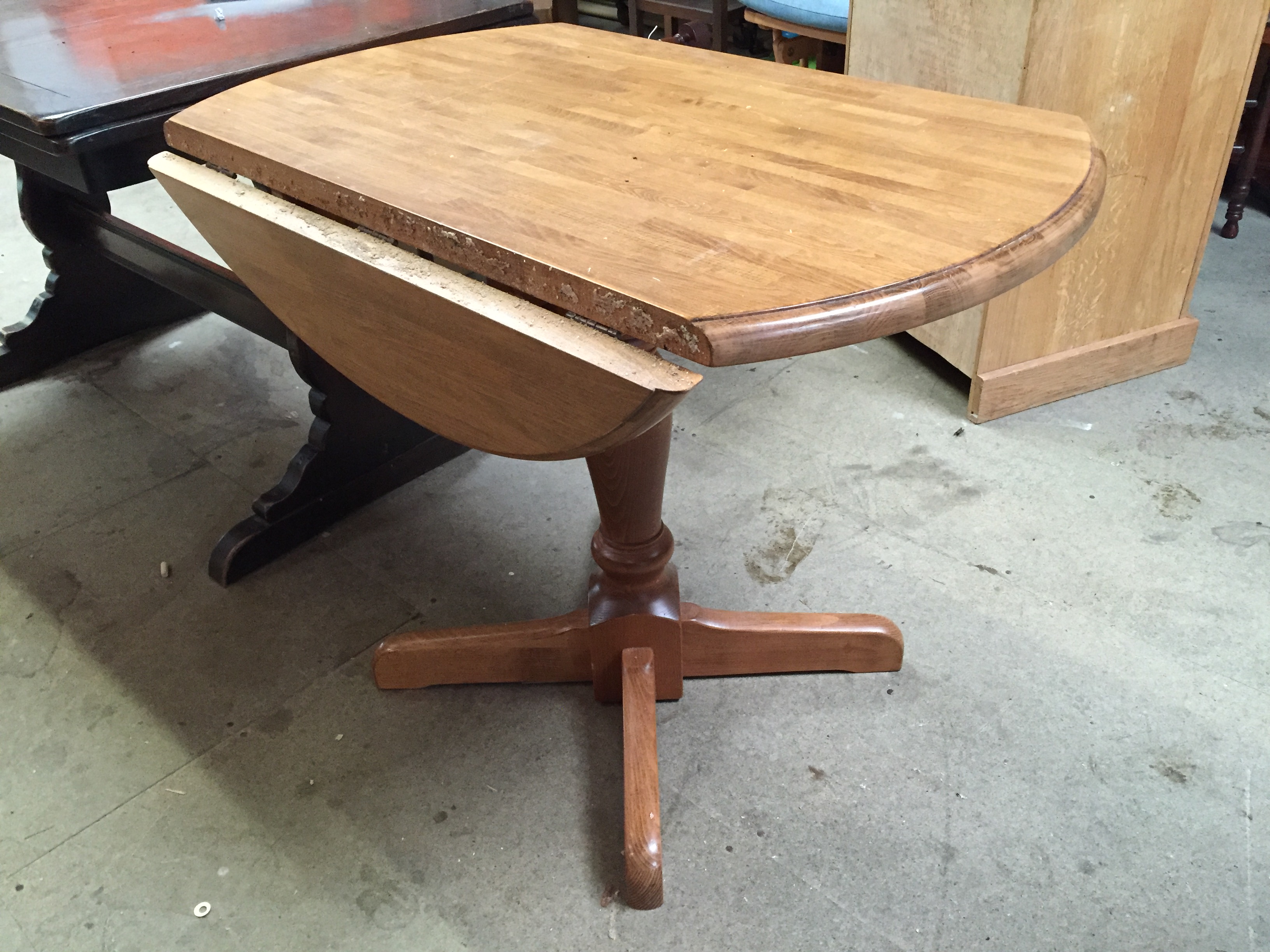 A pine double drop leaf table