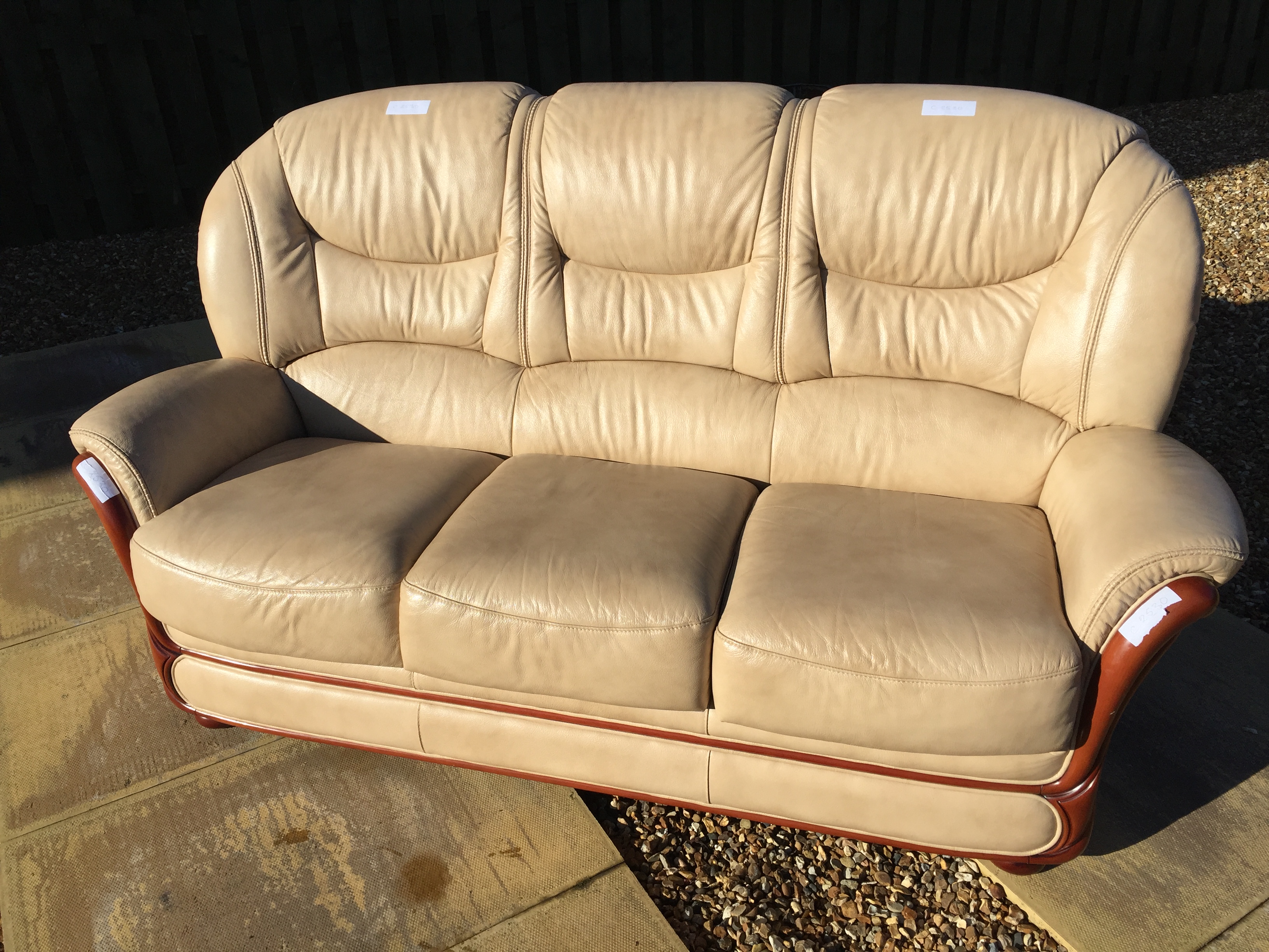 A brown leather sofa in excellent condition.