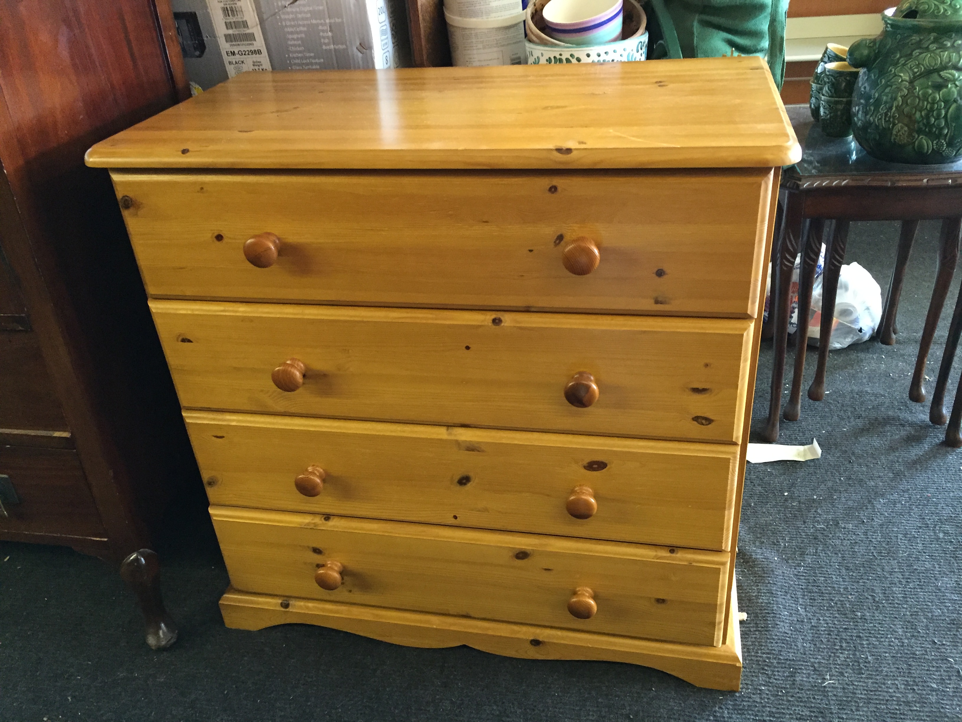 A pine four drawer chest of drawers.