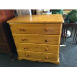 A pine four drawer chest of drawers.