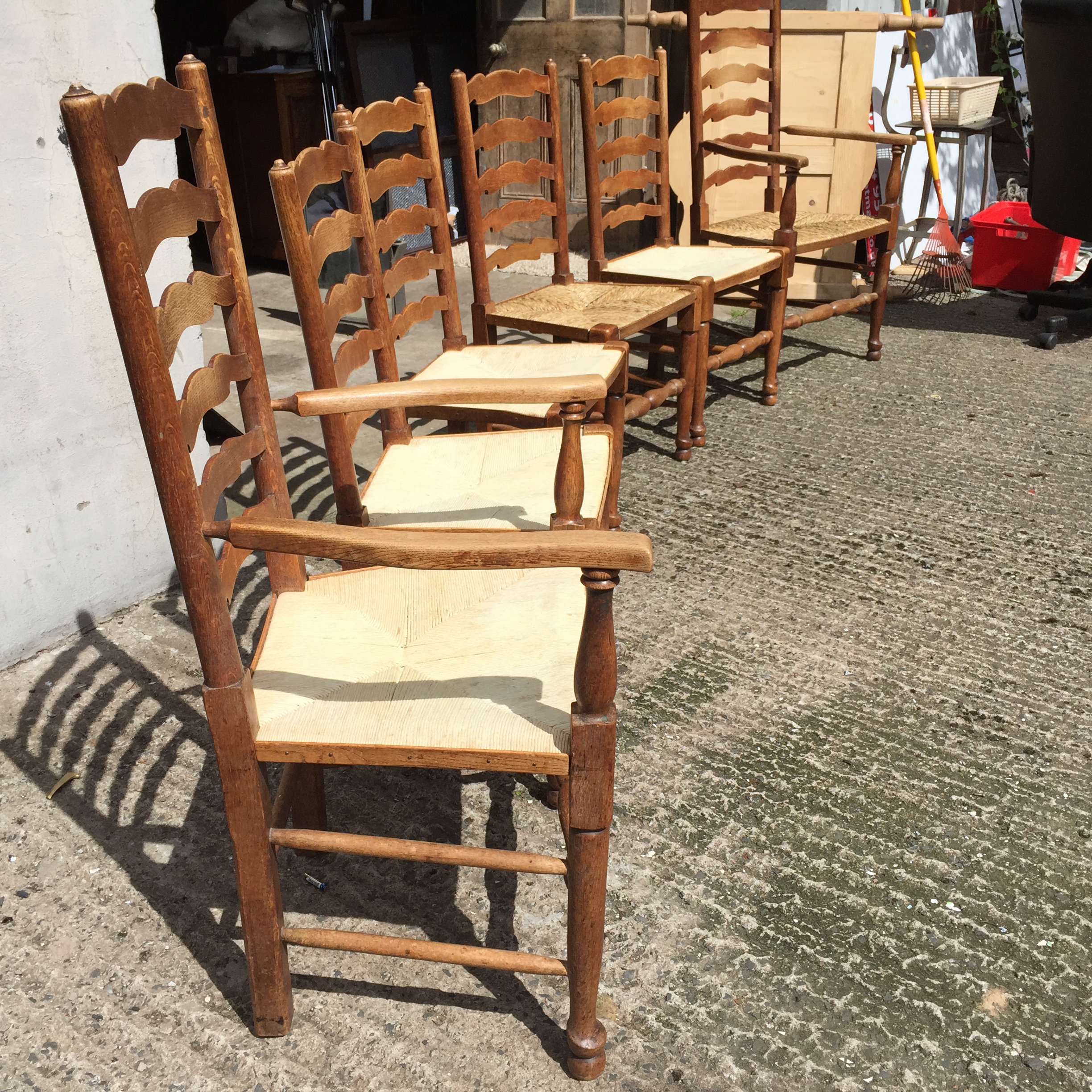 *A set of six oak ladder back dining chairs with rush seats two newly refurbished. - Image 2 of 3