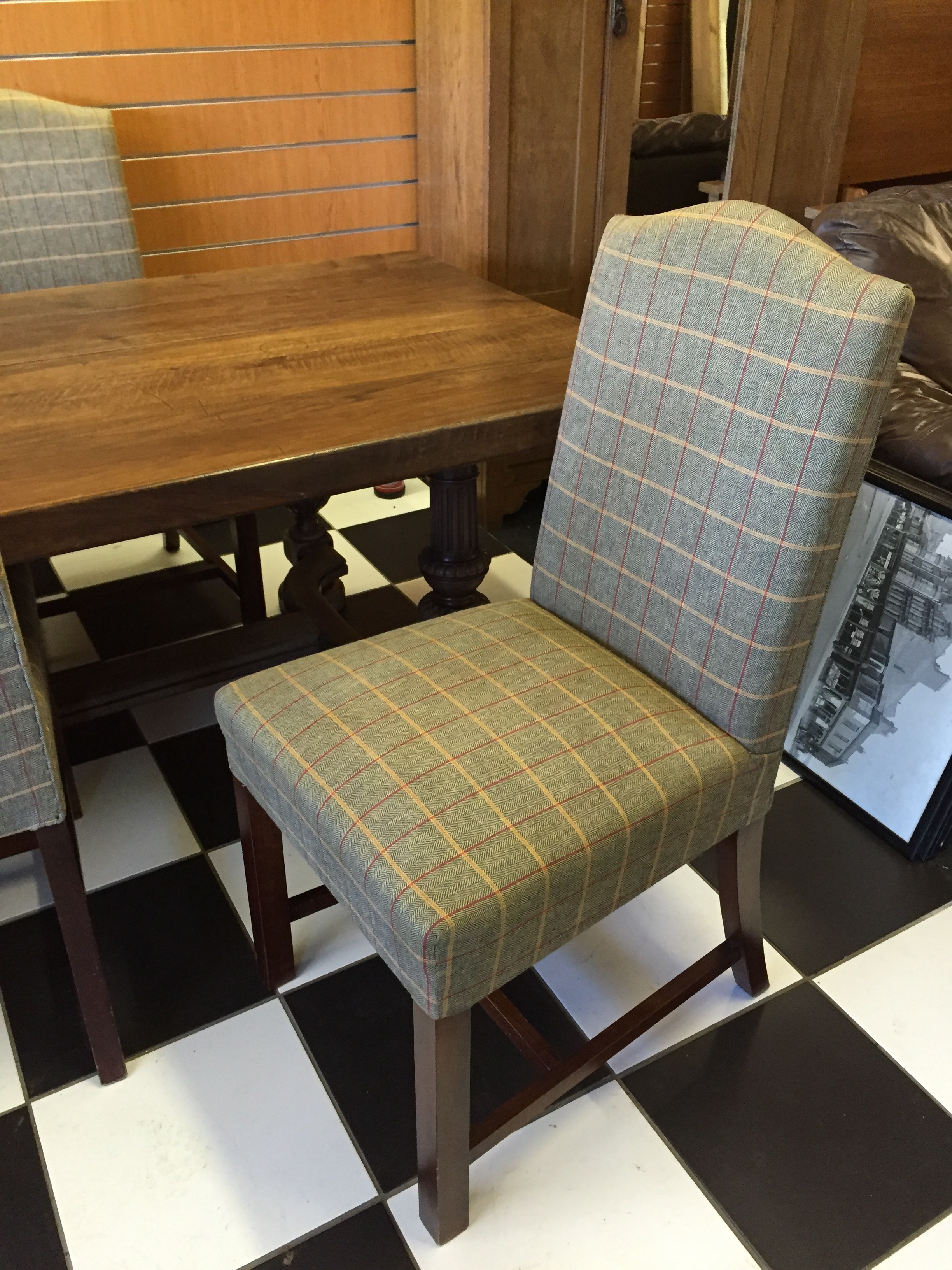 A oak refectory table and six high backed dining chairs.