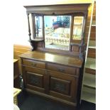 A mirror backed sideboard,
